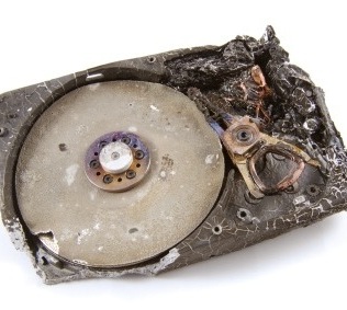 iStock_000008410500XSmall1 -A damaged disk that has been burned in a fire and has undergone fire and water damage data recovery.